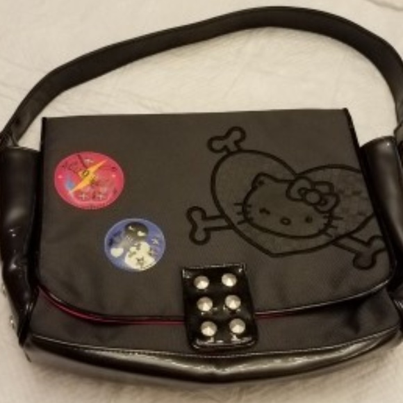 Sanrio Handbags - HELLO KITTY messenger style black w/ pink interior